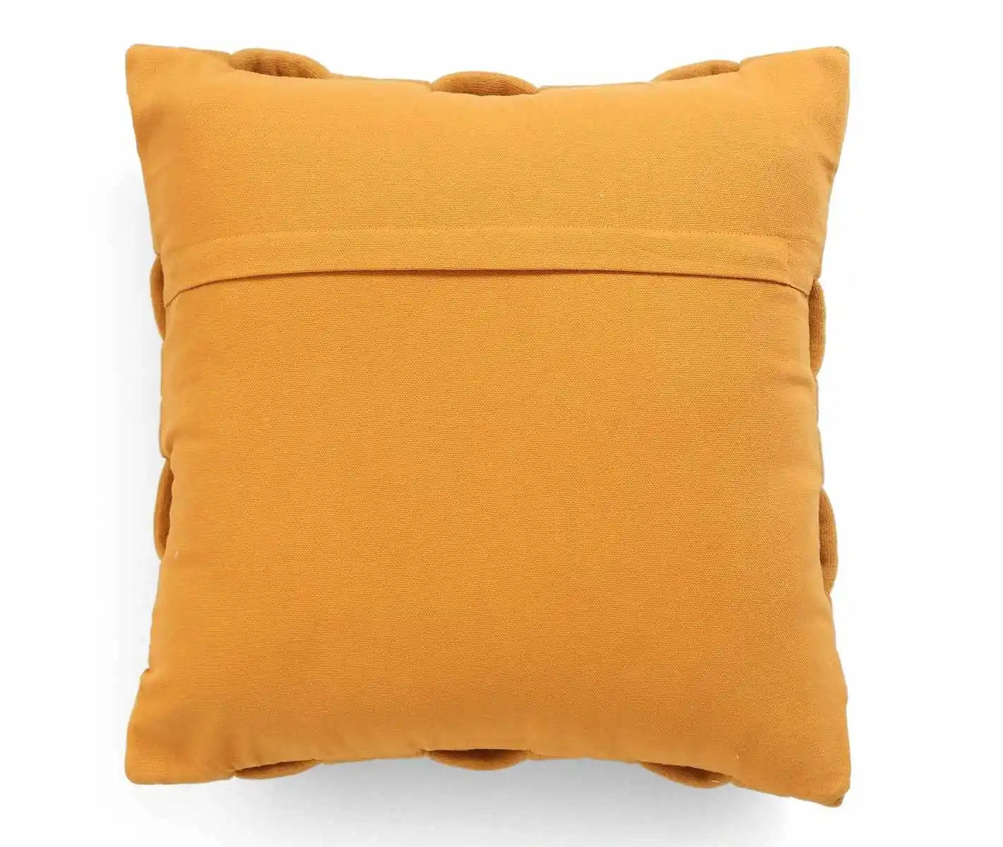 Mustard yellow textured cushion cover with pom-poms, cozy and stylish home décor accent