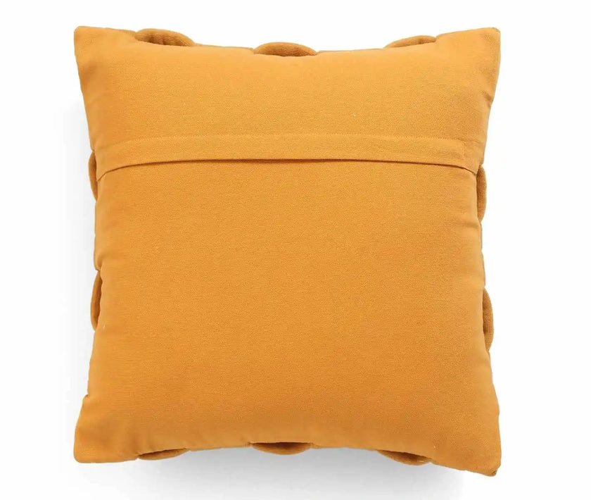 Mustard yellow textured cushion cover with pom-poms, cozy and stylish home décor accent