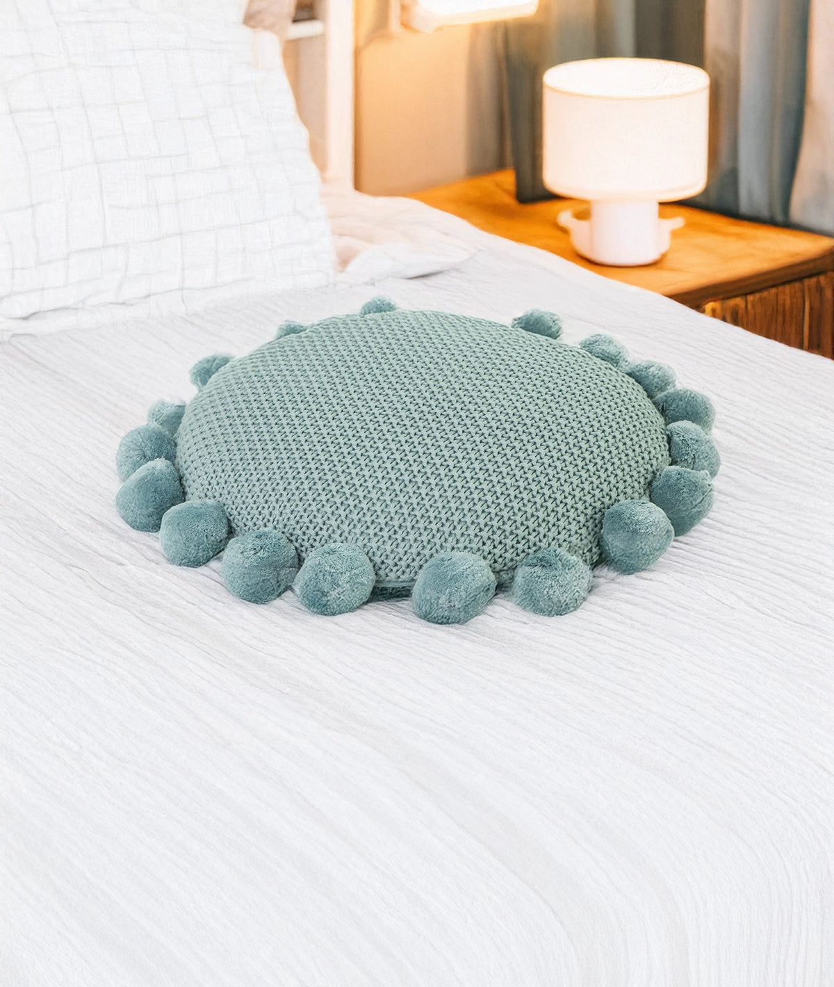 40cm diameter Sierkussen on a bed - Urbane Hide